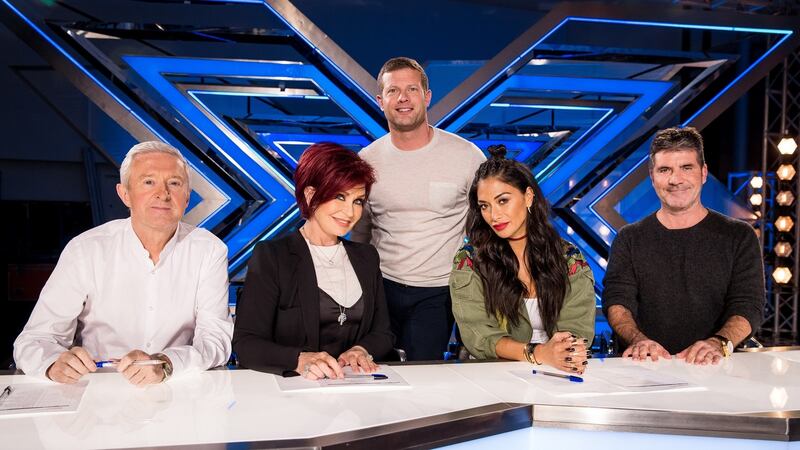 The X Factor: Dermot O’Leary with judges Louis Walsh, Sharon Osbourne, Nichole Scherzinger and Simon Cowell. Photograph: Tom Dymond/Thames/Syco