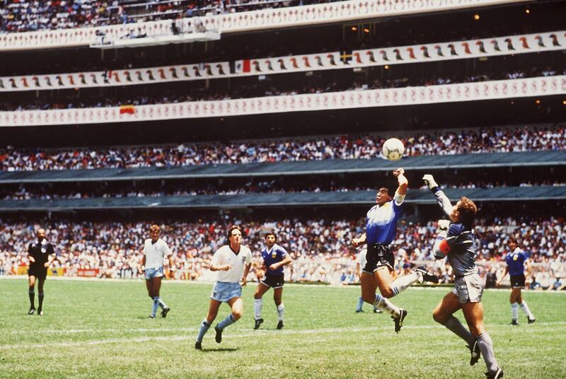 Diego Maradona outjumps England goalkeeper Peter Shilton to score with his ‘Hand of God’ goal during the 1986 World Cup quarter-final against England at the Azteca Stadium in Mexico City. Photograph: Bongarts