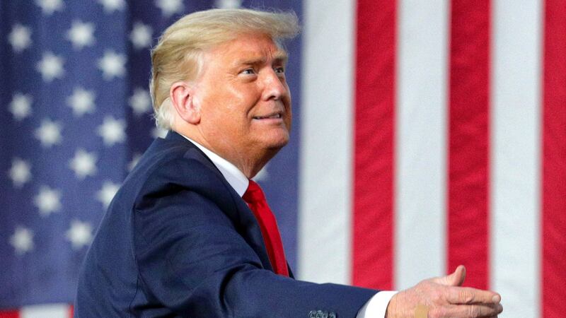 Donald Trump responds to cheering supporters at a campaign rally at Orlando-Sanford International Airport in Sanford, Florida on Monday, October 12th, 2020. Photograph: Joe Burbank/Orlando Sentinel/Tribune News Service via Getty Images