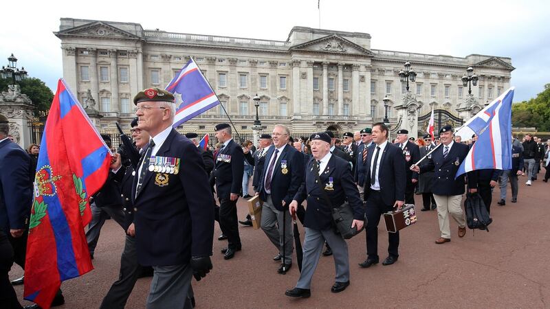 Supporters of former British soldier Dennis Hutchings who has been charged over the fatal 1974 shooting of a man in Northern Ireland, take part in a protest to call for an end to prosecutions of veterans who served during the Troubles, outside Buckingham Palace, London. Photograph: Gareth Fuller/PA Wire