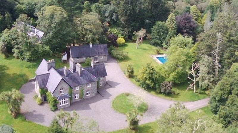 Glashnacree House in Sneem, Co. Kerry – a Victorian coastal country house complete with a 40 ft swimming pool, stables, tennis courts and two guest houses. It’s going to auction with a reserve range of €1.395k-€1.405k.