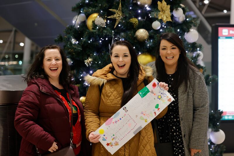  Marie Tierney (centre) on her return from Alberta, Canada, greeted by sisters Helen, Dublin and Bernie, Carlow for Christmas at Dublin Airport.  Photograph: Alan Betson / The Irish Times

