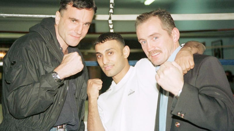 Actor Daniel Day-Lewis  poses with boxer Prince Naseem Hamed and Barry McGuigan  at Hamed’s training camp in New York.
