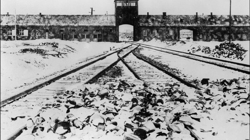 A picture taken in January 1945 depicts Auschwitz concentration camp gate and railways after its liberation by Soviet troops. AFP/AFP via Getty Images