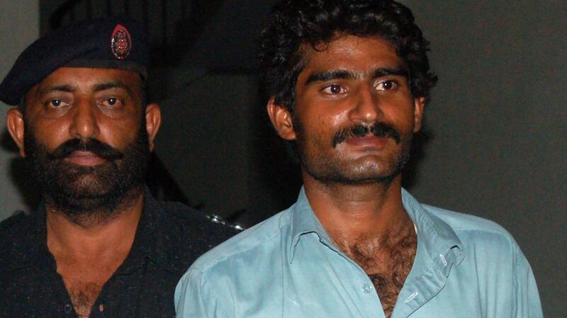 Muhammed Wasim (R), the brother of slain social media celebrity Qandeel Baloch, is escorted by police following his arrest for Qandeel Baloch’s death in Multan. Photograph: Mirzass Mirza/AFP/Getty