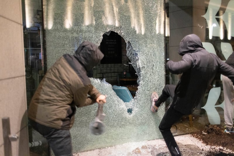 Rioters in Dublin on Thursday began breaking into businesses, and some shops were looted. Photograph: Chris Maddaloni