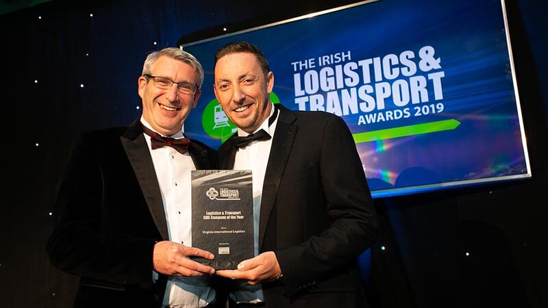 John Casey, Head of Asset Management, Rohan Holdings presents the Freight Forwarding Company of the Year award to Pamela Quinn, Kuehne + Nagel.