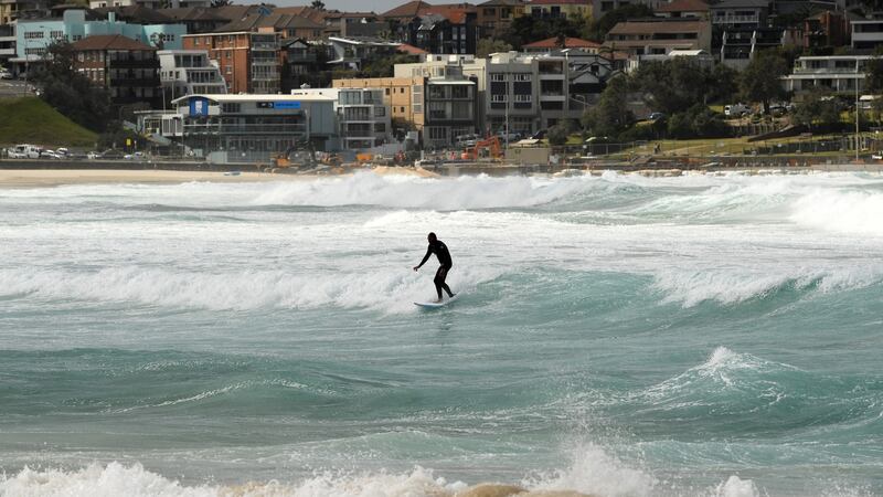A surfer during large swells at Bondi Beach in Sydney, Australia. Photograph: Joel Carrett/PA