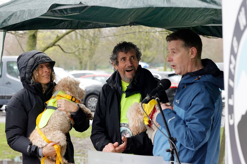 Charlie Bird  with his wife Claire and their dog Tiger and Dermot Bannon with his dog Bailey with supporters at the Phoenix Park event.  Photograph: Alan Betson


