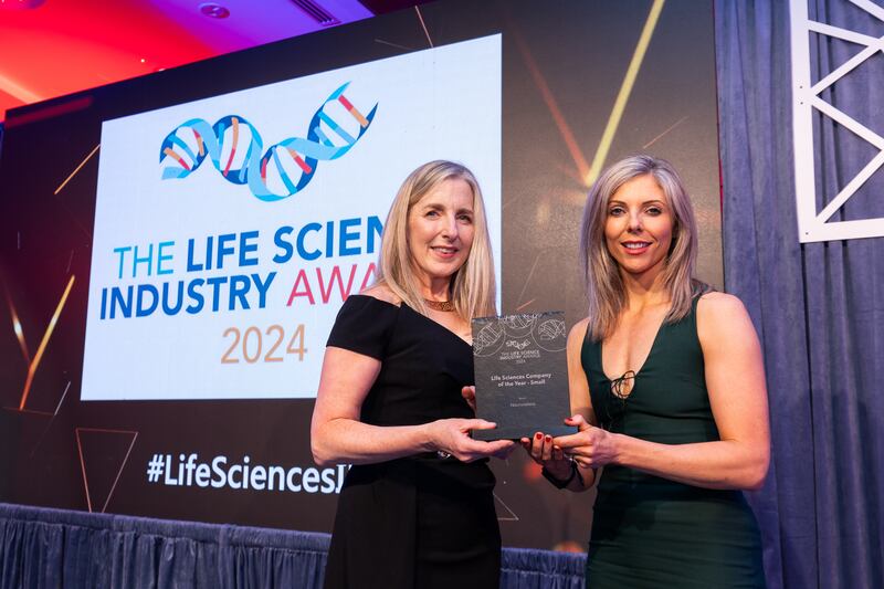 Adrienne Fleming, awards judge, presents the life sciences company of the year – small award to Sinead Watson, Neurovalens