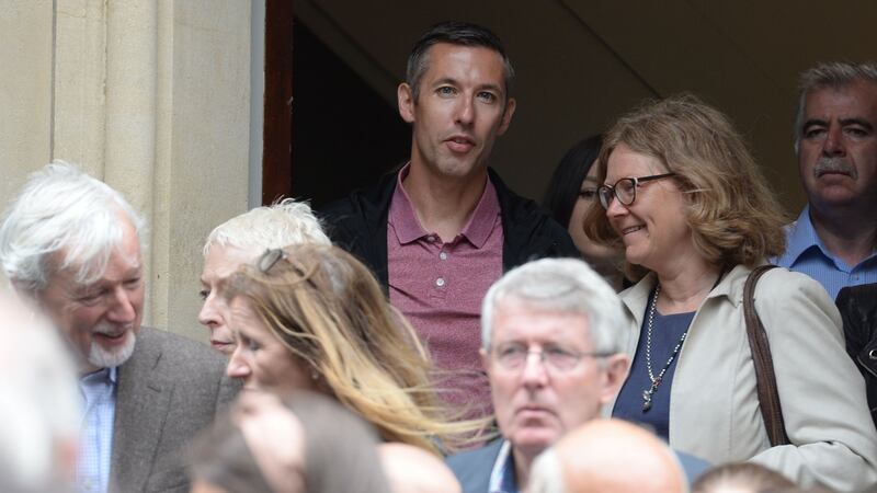 Writer and former colleague Shane Hegarty, with Sylvia Thompson at the funeral  of  Kate Holmquist. Photograph: Alan Betson / The Irish Times