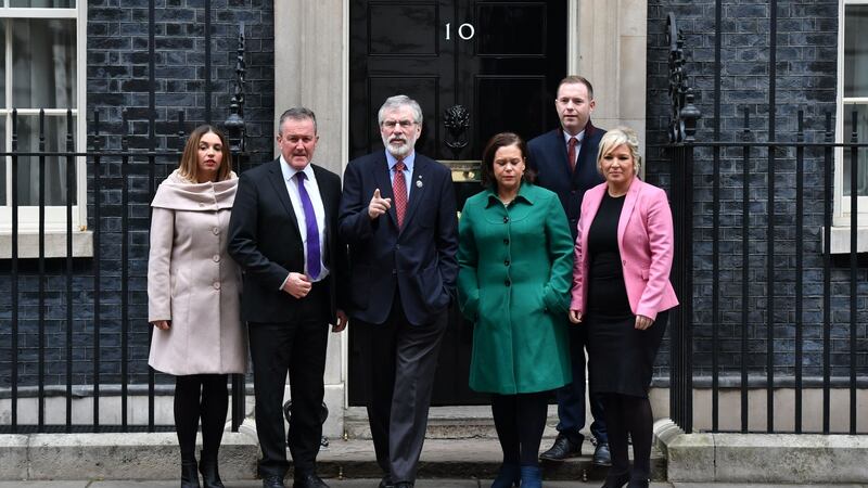 Gerry Adams (centre) and (left to right) Elisha McCallion, Conor Murphy, Mary Lou McDonald, Chris Hazzard and Michelle O’Neill leave Downing Street, after talks on the ongoing powersharing crisis at Stormont. Photograph: Dominic Lipinski/PA Wire