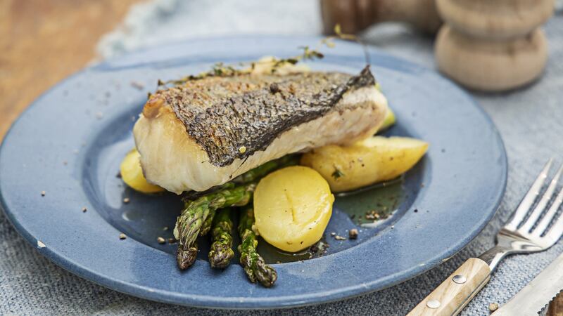 Hake with asparagus, new potatoes and lemon. Photograph: Harry Weir
