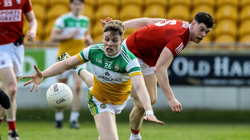 Offaly’s Johnny Moloney and John Cooper of Cork contest possession during the  Allianz Football League Division Two game at Bord na Mona O’Connor Park. Photograph: Lorraine O’Sullivan/Inpho