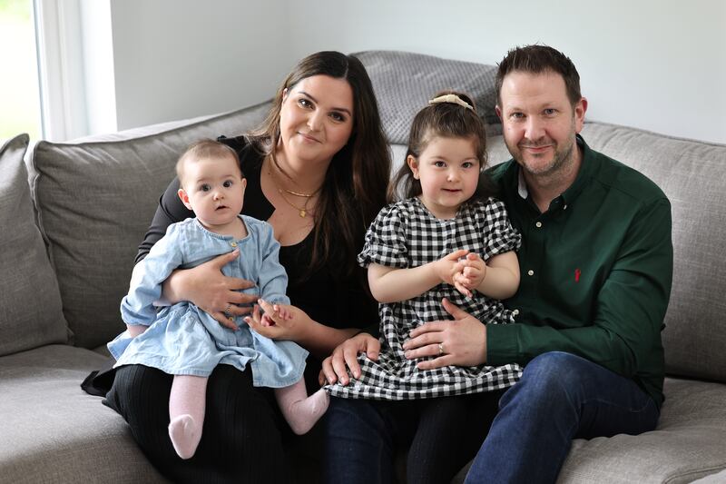 Kevin Bennett with wife Aisling and daughters Emily (3) and Daisy (9 months), at home in Balrath, Co Meath. Photograph: Dara Mac Dónaill