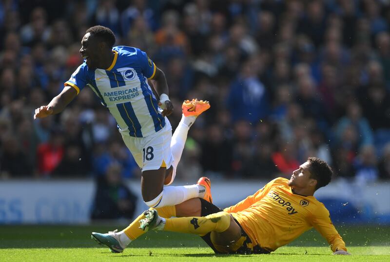 Danny Welbeck (left) is tackled by Joao Gomes. Photograph: by Mike Hewitt/Getty Images