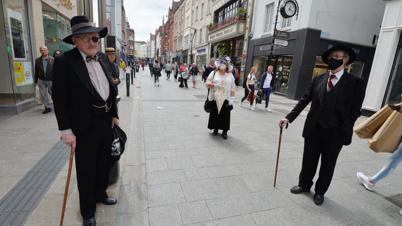 John Shevlin (R) and Caroline Elbay are seen on Grafton Street, Dublin, on Bloomsday 2020. Photograph: Alan Betson/The Irish Times