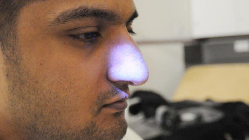 Mohammed Ali, under a UV light when he was arrested,is  covered in invisible liquid from handling a car with what he believed was ricin. Photograph: Greater Manchester Police/PA Wire