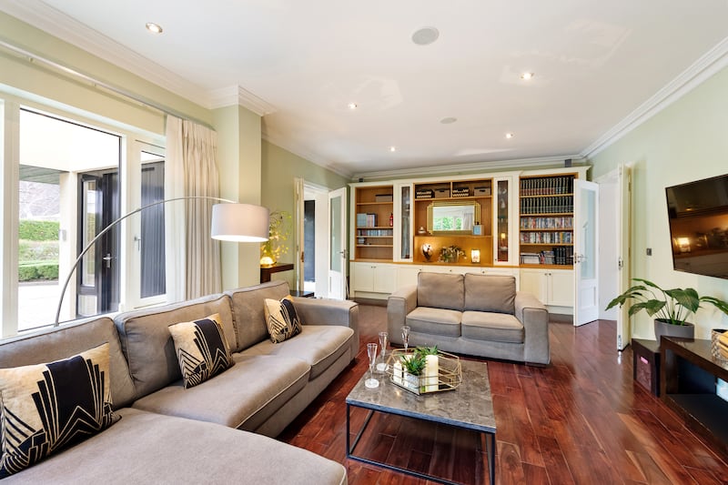 Downstairs, a livingroom and a family room both have American walnut flooring and are dual aspect, while the kitchen/dining area opens out to the back garden. 