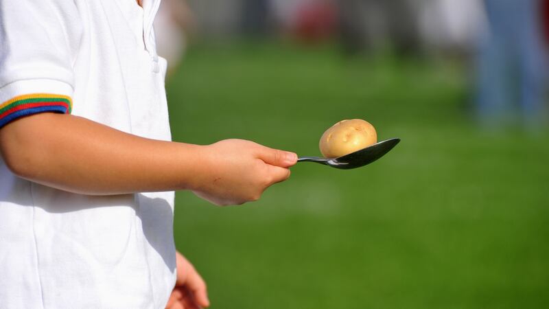 under 5 children sports day in school, a game of potato and spoon race
