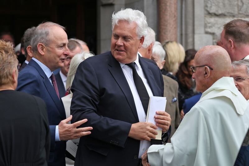 Tánaiste Micheál Martin with Gavin O'Reilly (centre) after the service. Photograph: Colin Keegan/Collins