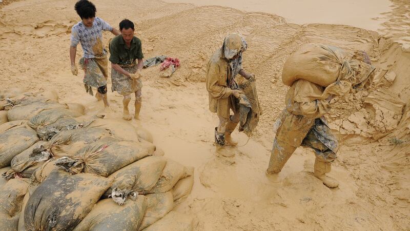 Labourers at a   rare earth metals mine in Jiangxi province, China. Photograph: Jie Zhao/Corbis via Getty Images