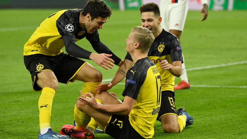 Giovanni Reyna (left) congratulates  Erling  Haaland after he opened te scoring in the Champions League last 16 first-leg against Paris Saint-Germain. Photograph: Ina Fassbender/AFP via Getty Images