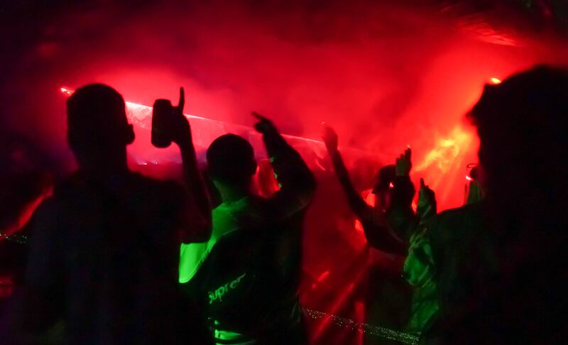 Many bring their own alcohol but a makeshift wooden drinks hut is constructed, selling cans of beer, spirits and mixers. Photograph: Enda O'Dowd