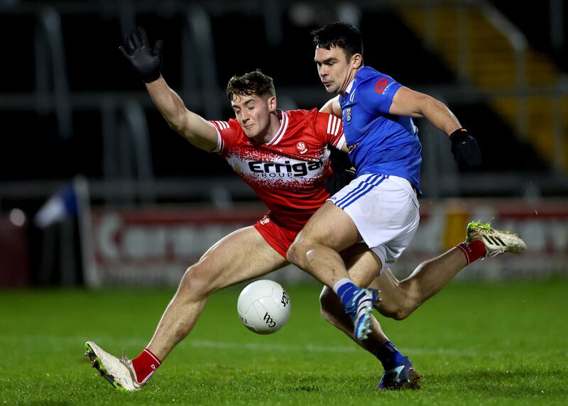 Derry’s Dan HIggins and James Galligan of Cavan. Photograph: James Crombie/Inpho