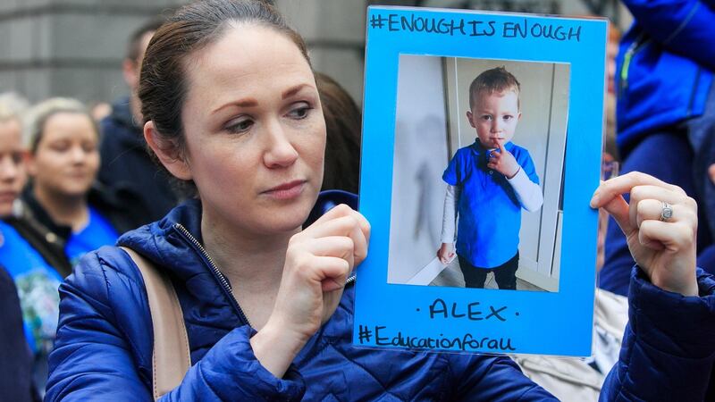 Catherine Andrews with a photo of her son Alex Andrews (3 and a half) from Blanchardstown in Dublin, during a protest to demand equal access to education for children with autism, intellectual disability and other complex needs at Leinster House, Dublin. Photo: Gareth Chaney/Collins