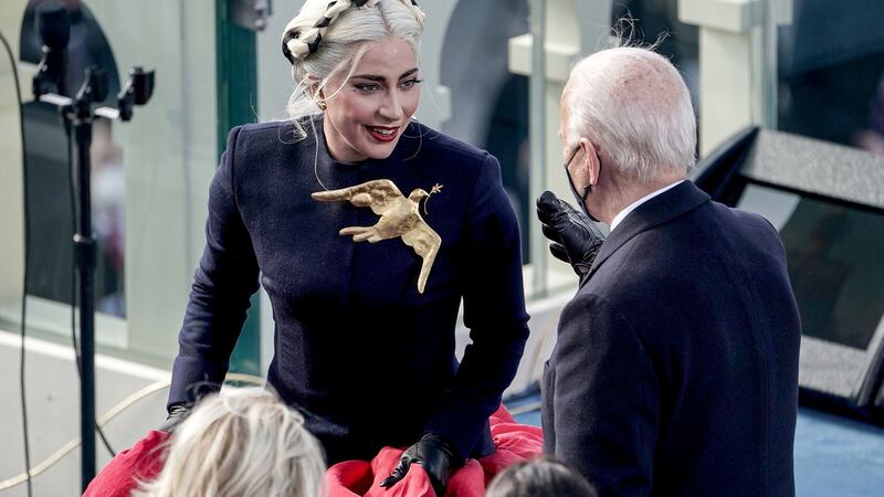Lady Gaga and President Joe Biden speak  at the US Capitol in Washington. Photograph:  Greg Nash/POOL/AFP via Getty Images