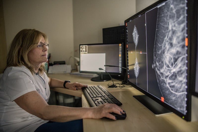 Dr. Éva Ambrózay, a radiologist at Bács-Kiskun County Hospital in Kecskemét, Hungary, Feb. 20, 2023. Hungary has become a major testing ground for AI software to spot cancer, as doctors debate whether the technology will replace them in medical jobs. (Akos Stiller/The New York Times)