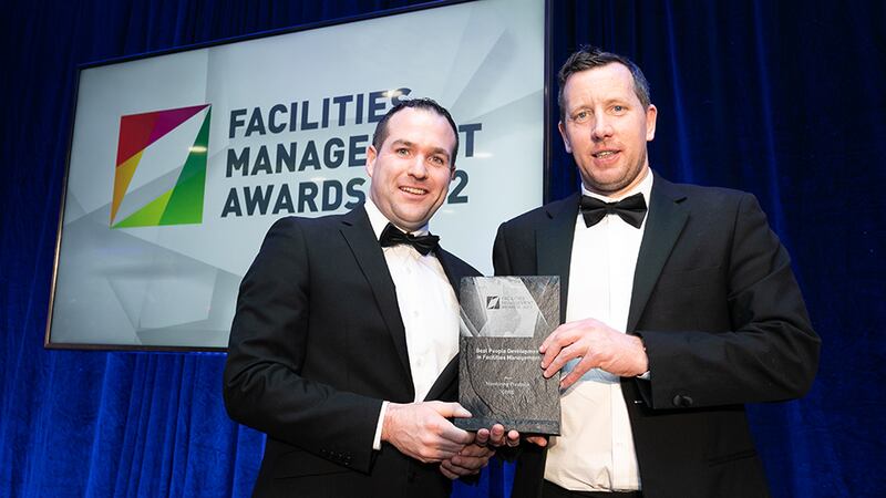 Martin McNally, Head of Smoke Ventilation & Service, Williaam Cox, presents the Best People Development in Facilities Management Award to Alan Sweeney, CBRE.