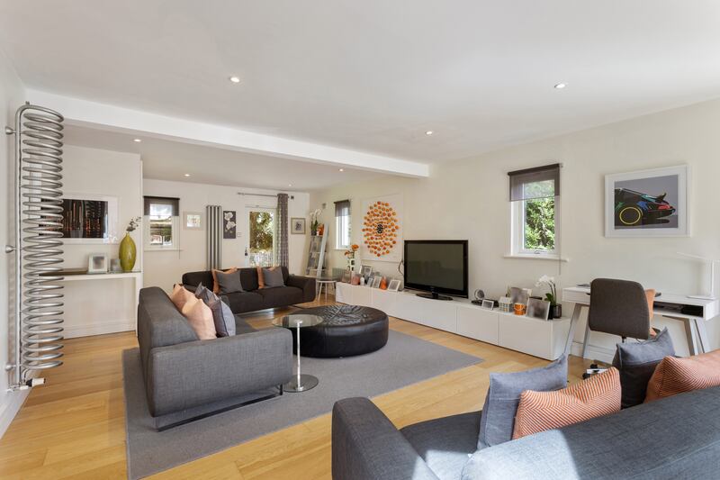 To the right of the entrance hall is a large family room that runs from the front to rear of the house.