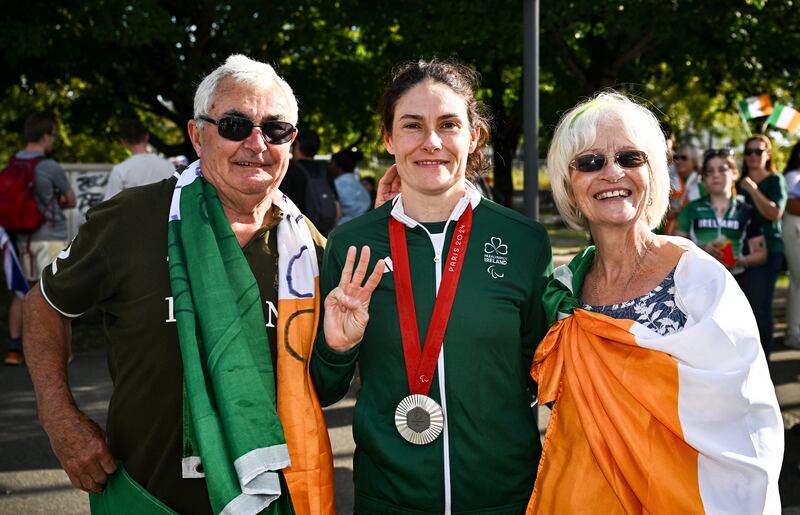 Paralympic cyclist Katie-George Dunlevy with her parents John and Alana at the Paris 2024 Paralympic Games. Photograph: Harry Murphy/Sportsfile