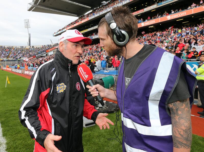 Colm Parkinson interviews Tyrone manager Mickey Harte for Newstalk after the 2013 All-Ireland quarter-final against Monaghan. Photograph: Cathal Noonan/Inpho
