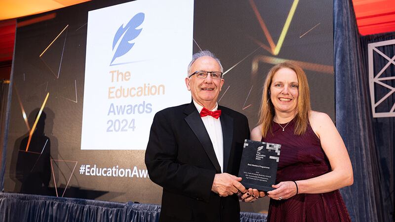 Dr Matt Cotterell, awards judge, presents the best masters programme award to Dr Olive McCarthy, UCC Cork University Business School