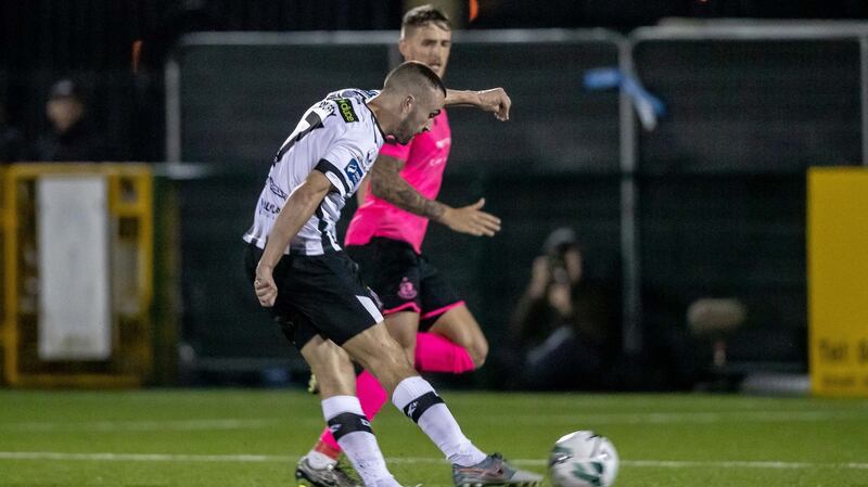 Michael Duffy  fires home Dundalk’s third goal in the  SSE Airtricity League Premier Division match  at Oriel Park. Photograph: Morgan Treacy/Inpho
