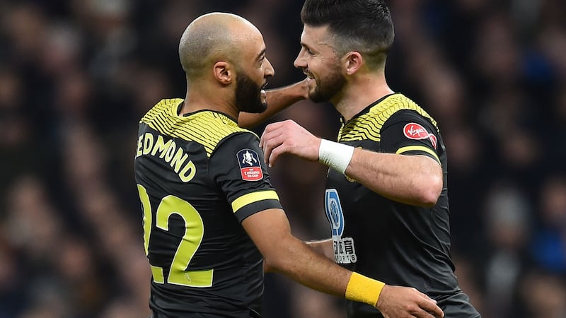 Southampton striker Shane Long  celebrates scoring his goal with Nathan Redmond during the FA Cup fourth-round replay against Tottenham Hotspur at Tottenham Hotspur Stadium. Photograph:   Glyn Kirk/AFP via Getty Images