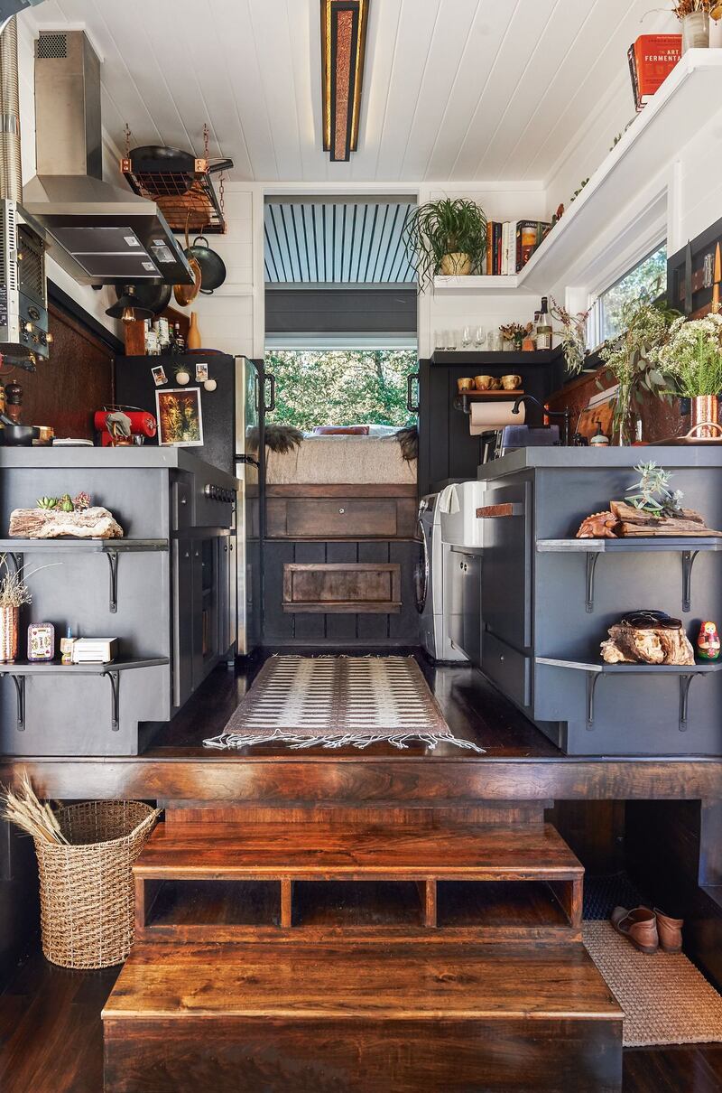 The galley kitchen, with master bedroom beyond, of the home of Bela Fishbeyn, Spencer Wright and their daughter, Escher, a so-called tiny house in California. Photograph: Sian Richards