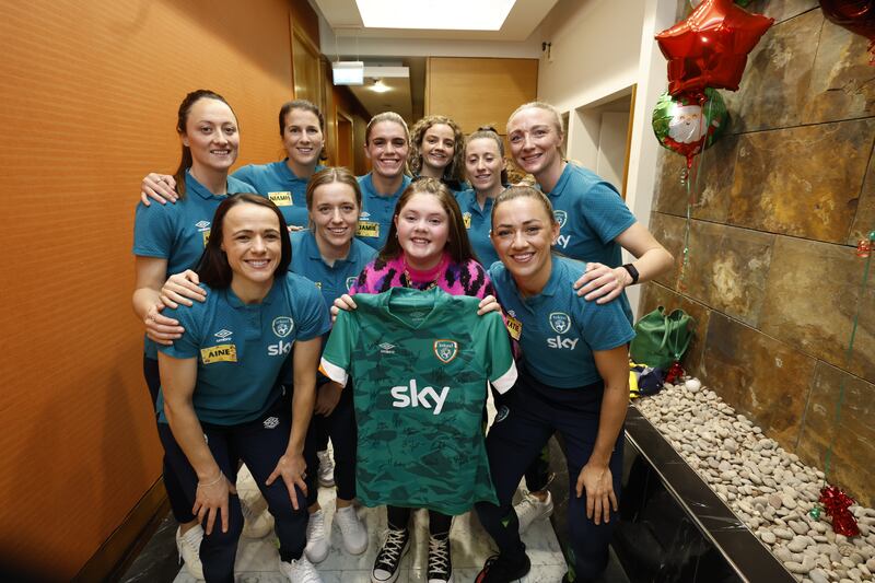 The Late Late Toy Show: 12-year-old Emmie O'Neill with some of the Ireland soccer players she'll be watching in Australia. Photograph: Andres Poveda