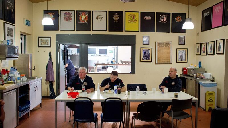 Dolphin’s Barn Fire Station D Watch: District Officer Justin Burns, Brian Kelly and Paddy Feehan fuel themselves for the night ahead. Photograph: Tom Honan