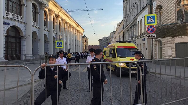 Policemen stand guard after a taxi ran into a crowd of people near Red Square in Moscow. The driver is quoted as saying he had not driven into the crowd on purpose. Photograph: Jack Stubbs/Reuters
