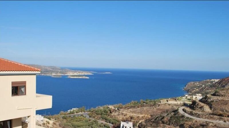 The 191sq m house in Crete is on a slope, giving it  great views