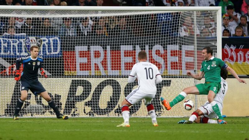Ireland’s John O’Shea (right) scores past Germany’s Manuel Neuer (left)  in Gelsenkirchen. Photograph: Wolfgang Rattay / Reuters