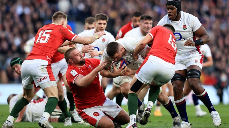 Charlie Ewels of England is challenged by Tomas Francis and Owen Watkin of Wales during their Guinness Six Nations match  at Twickenham on February 26th. Photograph: David Rogers/Getty Images