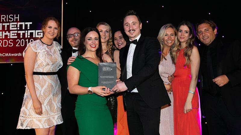 Barry Walsh, Awards Judge presents the Best Content Marketing Award - Internal Company Engagement to the EY Financial Services Team.