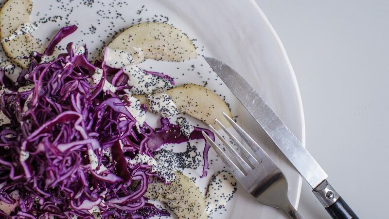 This red cabbage salad with blue cheese, pears and poppy seeds  can be fully prepared in advance of your dinner party. Photograph: Emma Jervis