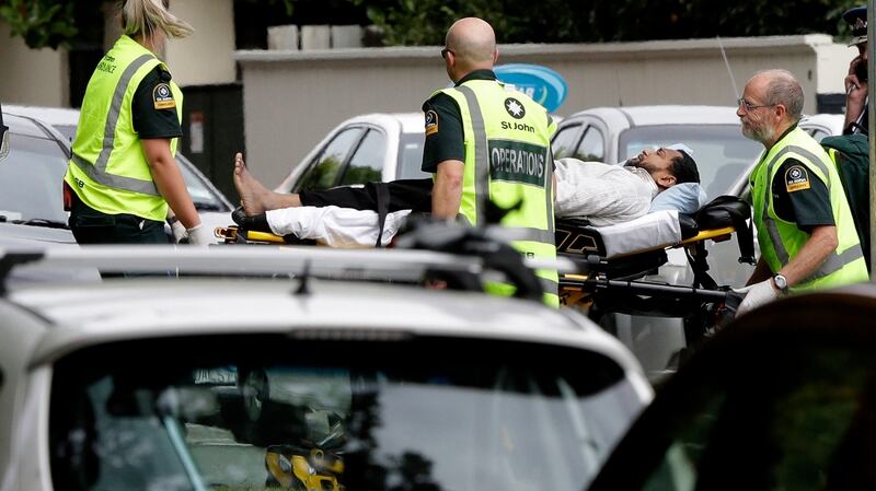 Ambulance staff take a man from outside a mosque in central Christchurch in New Zealand. Photograph: Mark Baker