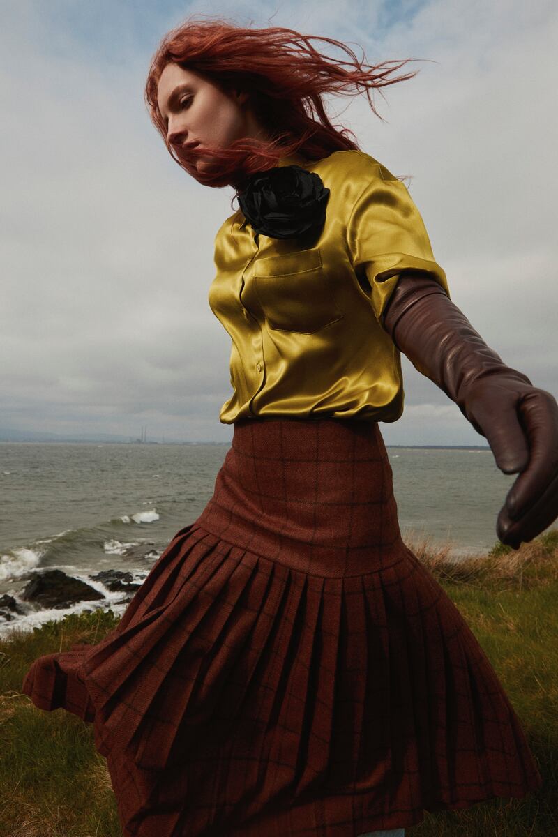 Aoife: Long-sleeved relaxed shirt in pistachio green, €285; textured pleated wool tailored skirt in chocolate brown, €590.